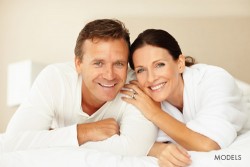 happy couple in white posing