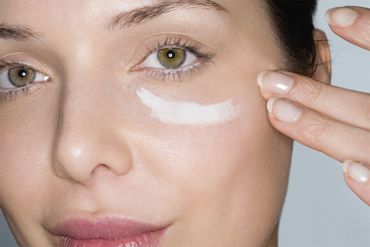 woman applying eyecream