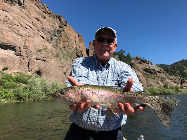 Dr. Ervin Wheeler holds up his latest fishing catch