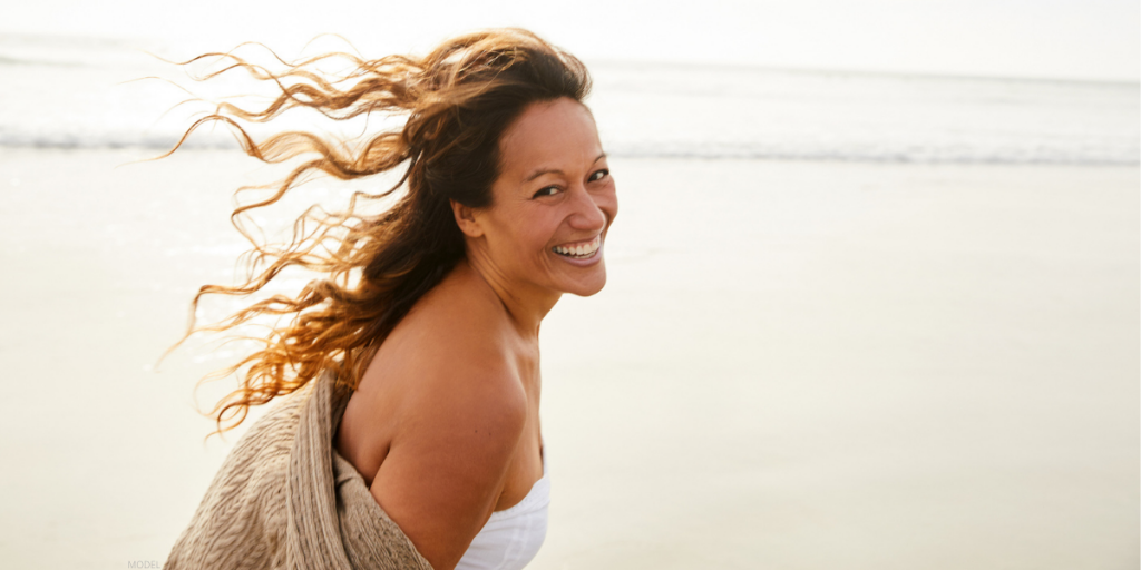 Woman on San Diego beach after a Facelift (model)