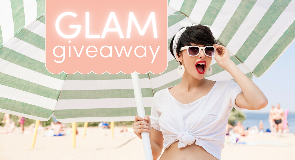 Surprised brunette at the beach holding a striped umbrella [GLAMgiveaway]