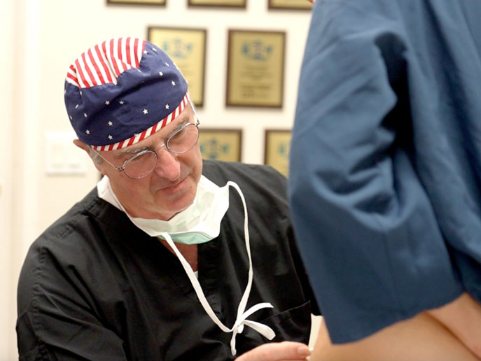 Dr. John Smoot dressed in medical attire