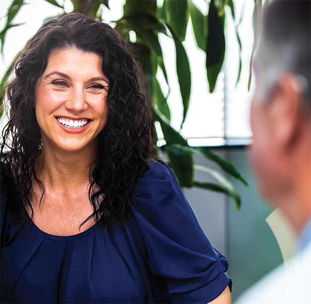 Happy female patient smiling after cosmetic treatment at LJCSC – La Jolla Cosmetic Surgery Centre.