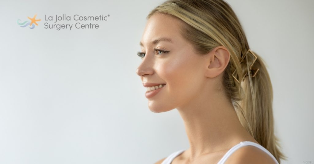 Woman with a ponytail in a white tank top (model) La Jolla Cosmetic Surgery Centre Logo