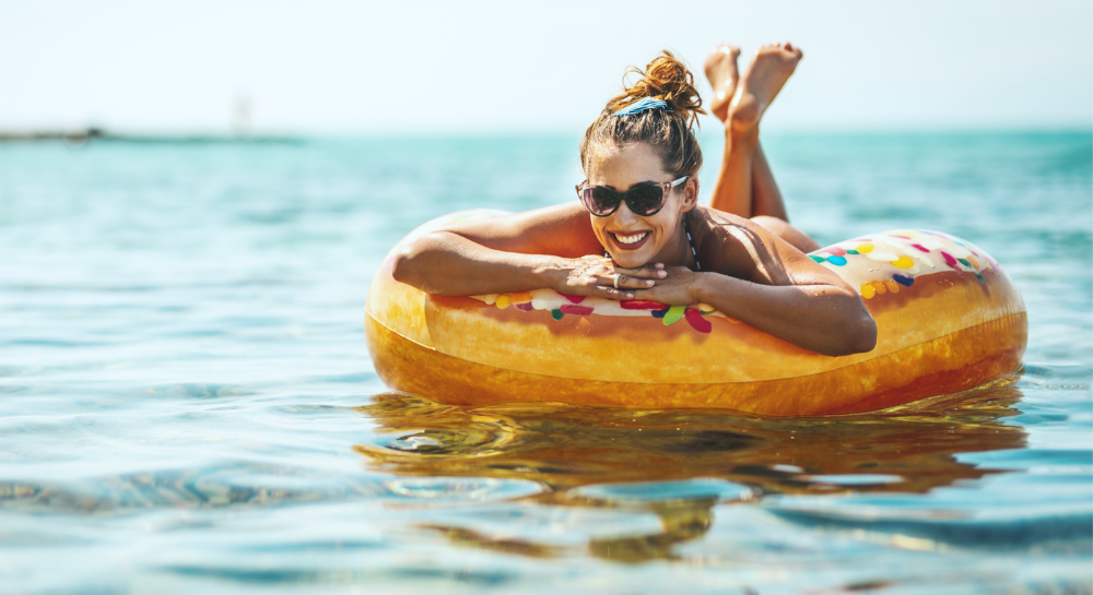 Woman in an inner tube floating in the ocean