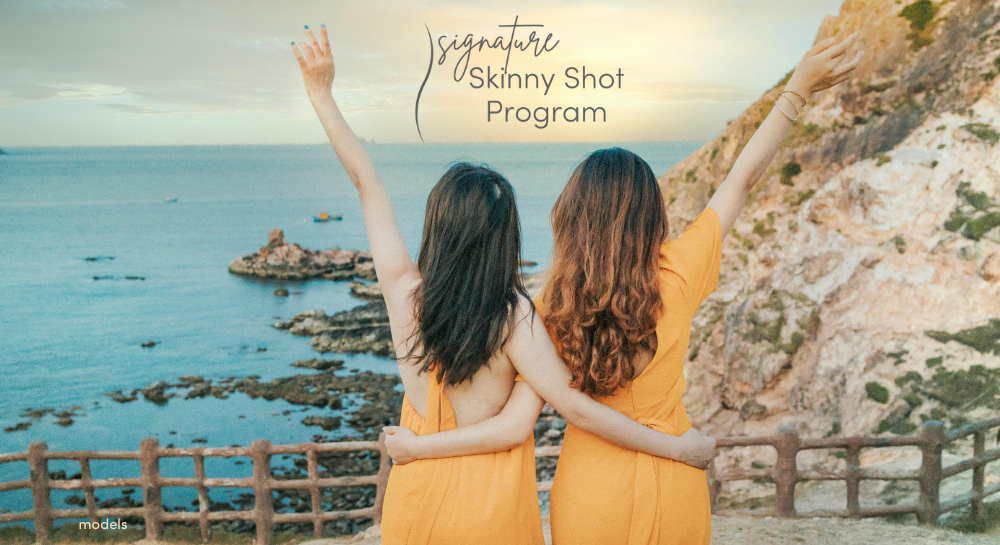 female friends arm in arm celebrating the ocean view [Signature Skinny Shot]
