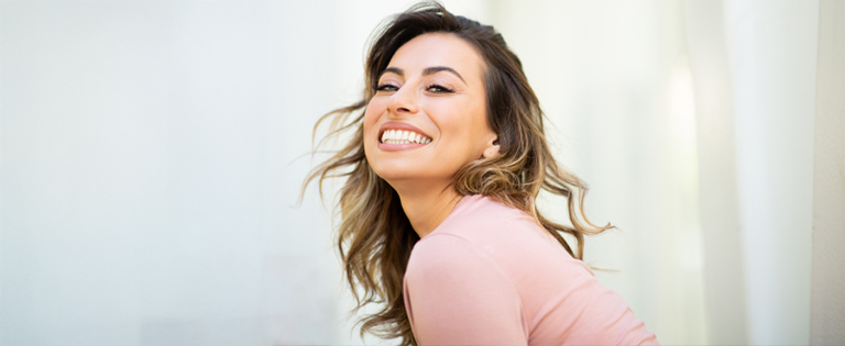 Smiling woman with shoulder-length brown hair